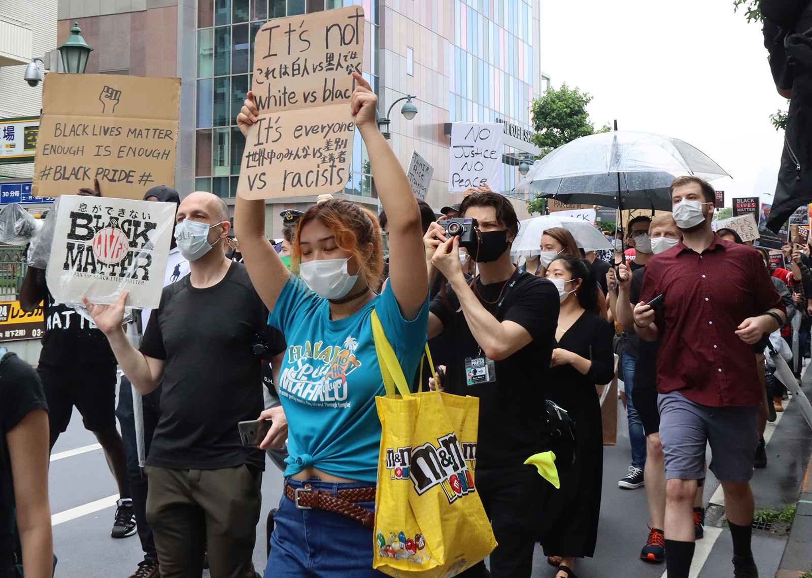 Protestors raising placards march through Shibuya district to protest against racism and violence by police in Tokyo on Sunday, June 14, 2020. Some 1,000 people gather for Black Lives Matter rally as black man George Floyd killed by police in Minneapolis.