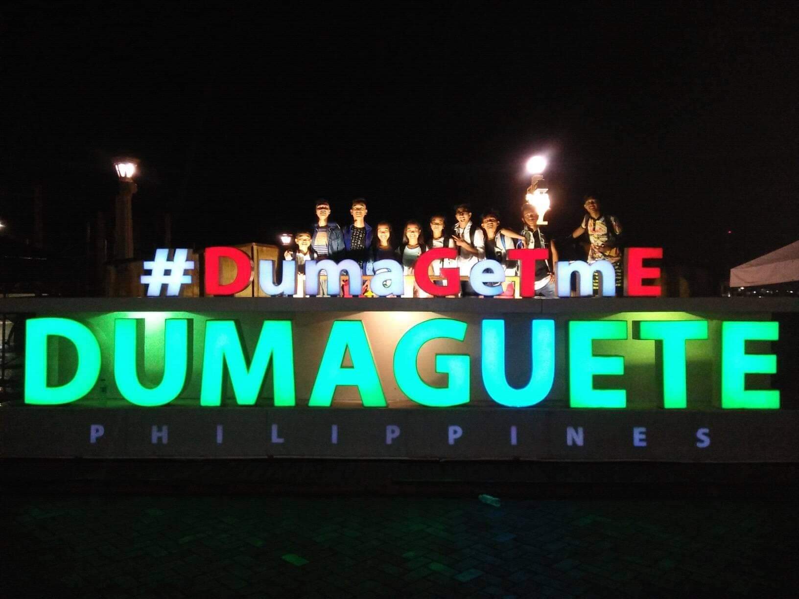 The Basay National High School team pose at the #DumaGeTmE sign before beginning their travel home.