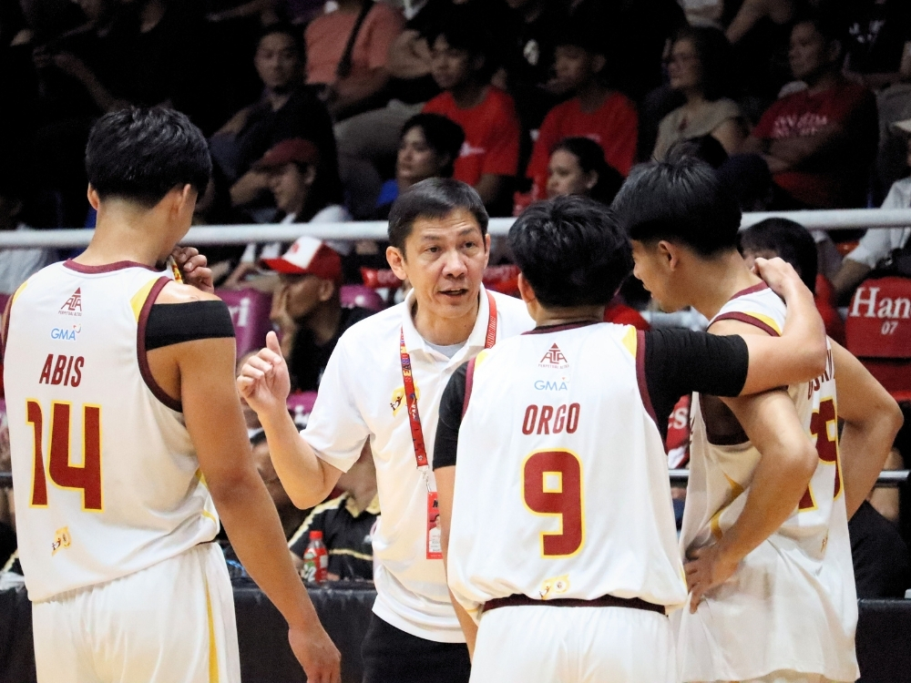 Perpetual's John Abis, Shawn Orgo, and Mark Gojo Cruz with Coach Olsen Racela | Photo: Zane Esparaga