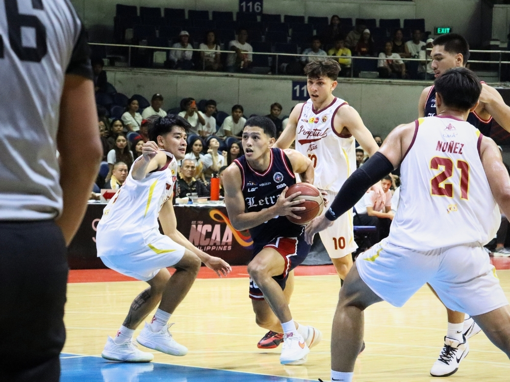 Jimboy Estrada drives against two Perpetual defenders in Game 1 of their semis date | Zane Esparaga