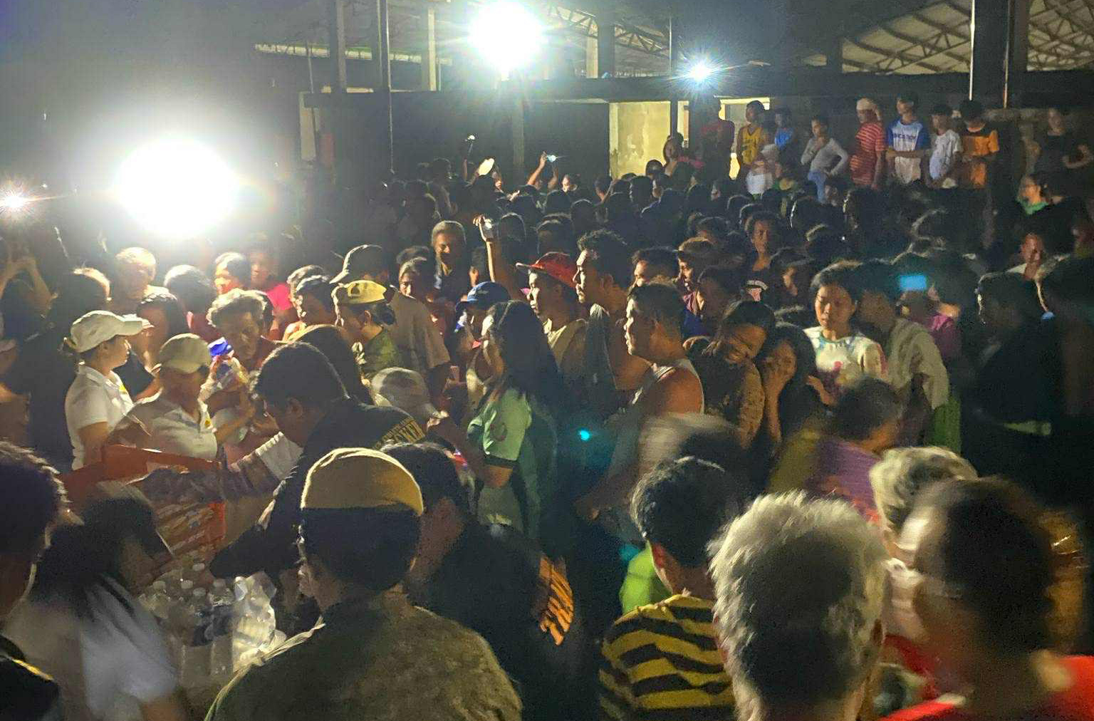 Families affected by the earthquake line up for relief goods during the Kapuso Operation Bayanihan.