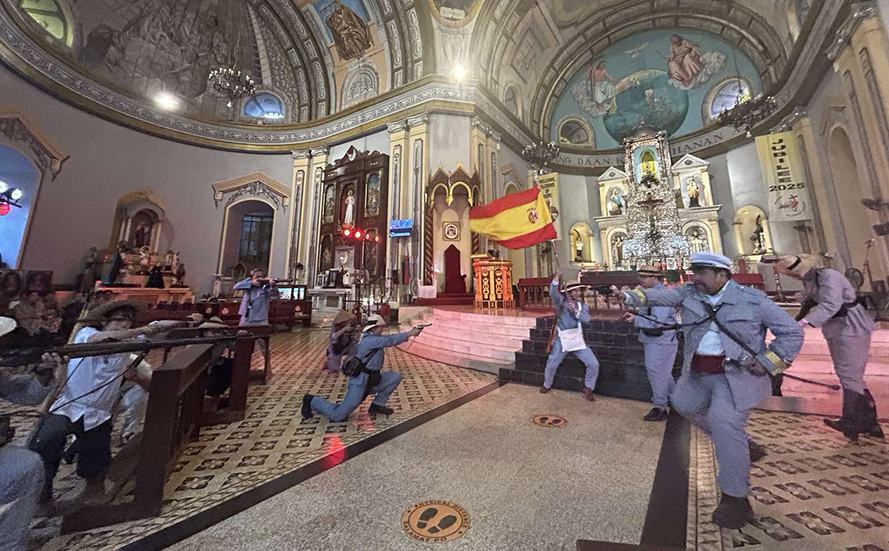 Reenactment of the battle in the Lipa Cathedral where Spanish forces were defeated in June 1898.