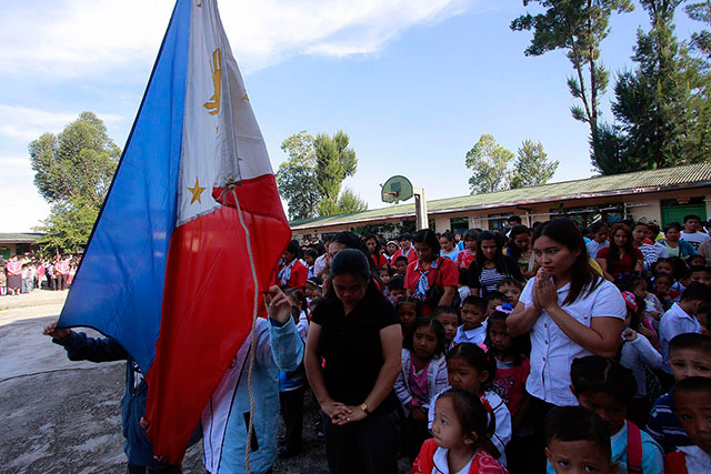 The Philippine flag is raised during school opening at an elementary school in Baguio City. FILE PHOTO
