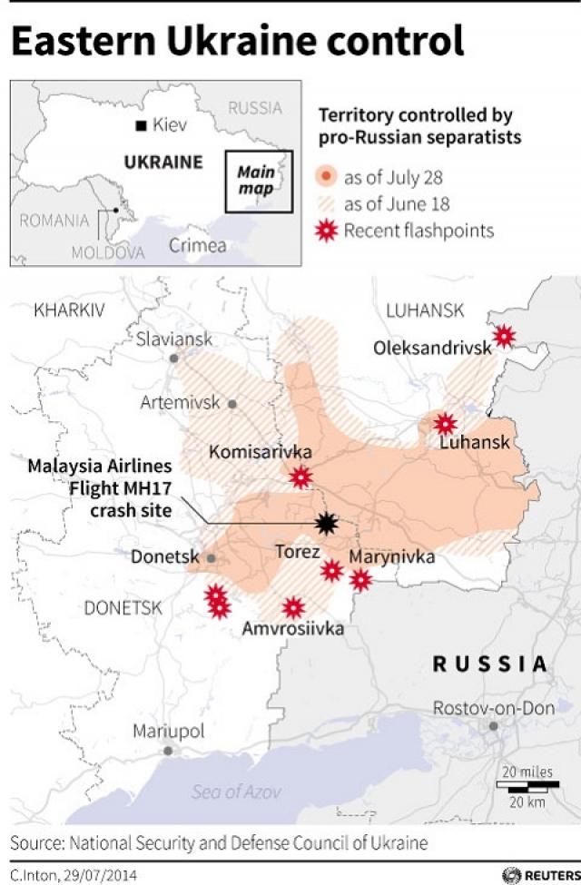 Merkel says tightening Ukraine-Russian border is key to peace deal