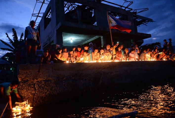 Weeks before Pope Francis's visit to the city, the people of Tacloban commemorate the first anniversary of Super Typhoon Yolanda, on November 8, 2014. AFP/ Ted Aljibe/ File photo