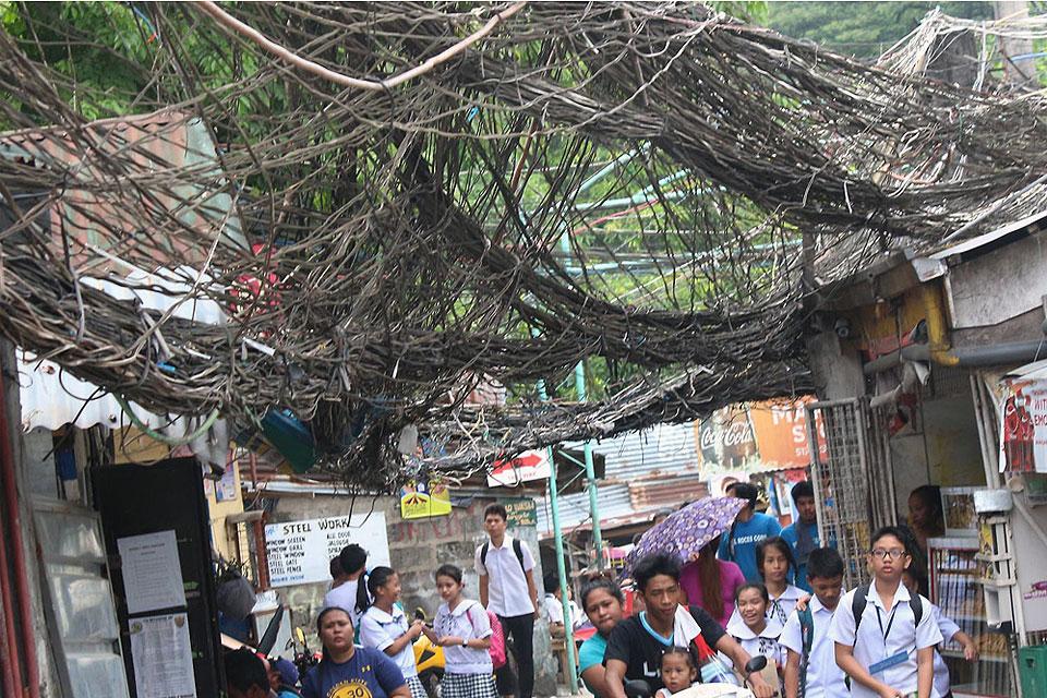 Web of of electrical wires poses danger in QC village Photos GMA