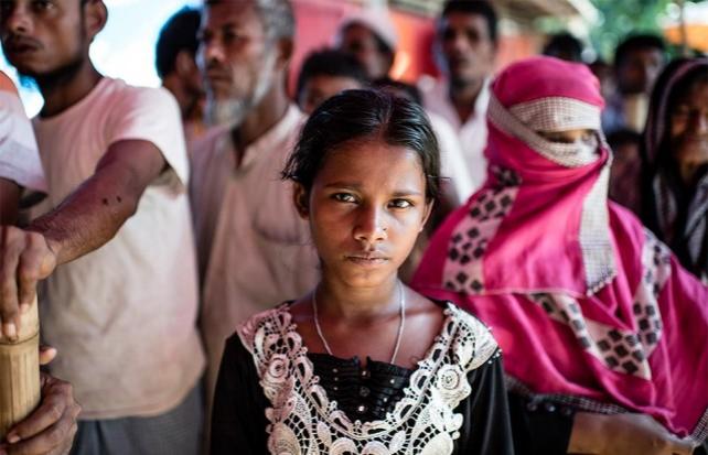 A girl stares at the camera at a relief distribution point in Kutupalong Camp, Ukhia Bangladesh. Atom Araullo