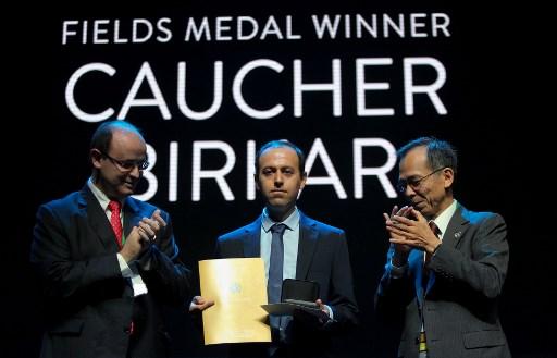 Former refugee wins 'Nobel of mathematics' medal, then loses it to ...