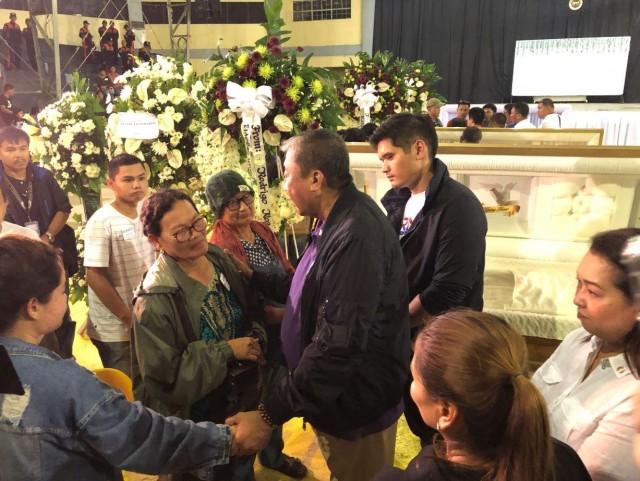 DOTr Secretary Arthur Tugade with relatives of victims of the Iloilo city-Guimaras sea mishap. PHOTO BY IAN CRUZ