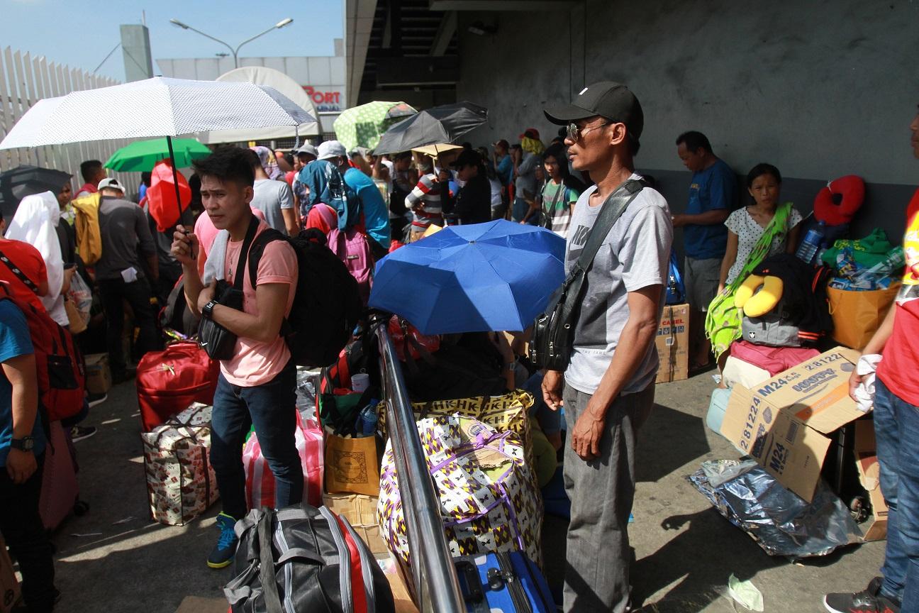 Stranded passengers at Manila port ask for food, water amid canceled ...