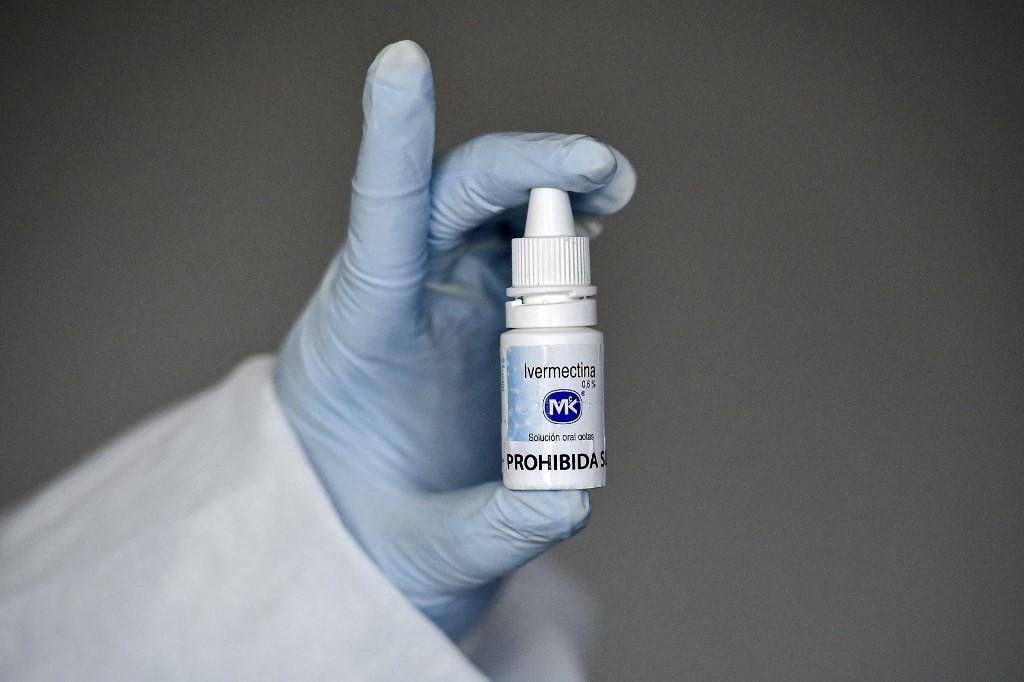 A health worker shows a bottle of Ivermectin, a medicine authorized by the National Institute for Food and Drug Surveillance (INVIMA) to treat patient