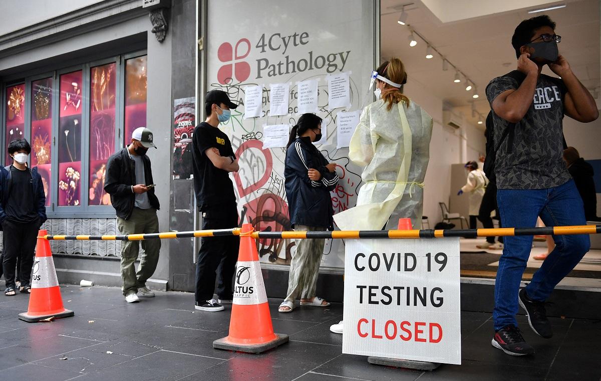 Australia PM blames Omicron for testing woes as COVID-19 cases hit downward trend
