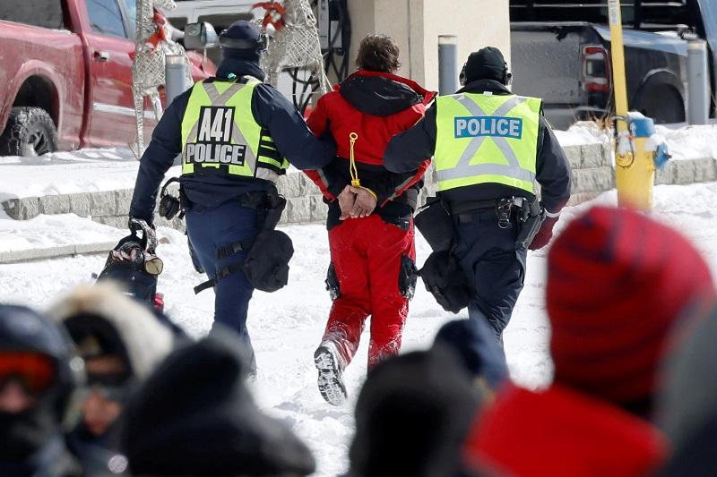 Canadian police arrest dozens to sweep protesters from parliament area