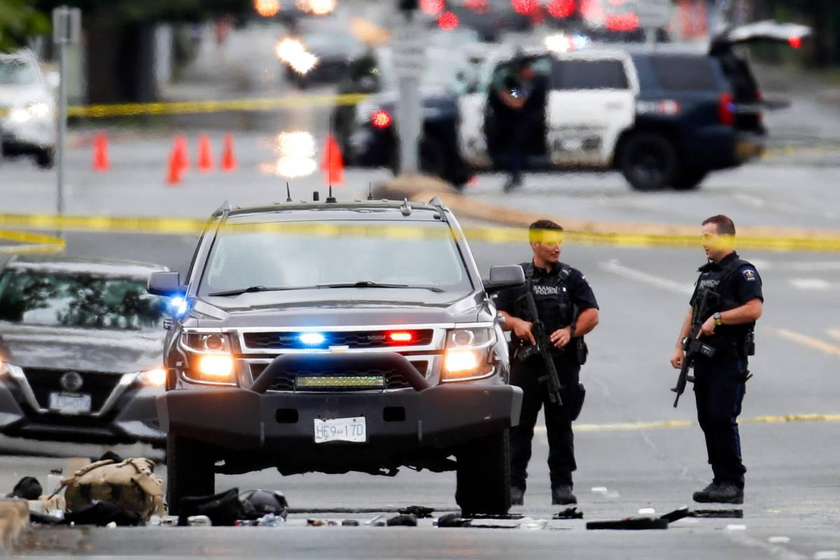 Two gunmen killed, six officers wounded in shootout at Canadian bank ...