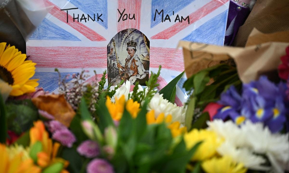 Flowers and tributes to Queen Elizabeth II are pictured in Green Park in London on September 15, 2022 as she lies in state at Westminster Hall, where thousands have queued to file past her coffin to pay their respects until her funeral on September 19. Oli Scarff/ AFP