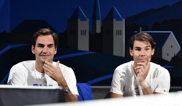 Team Europe's Roger Federer and Rafael Nadal watch a match as part of the 2019 Laver Cup tennis tournament in Geneva, on September 20, 2019. Fabrice Coffrini/ AFP