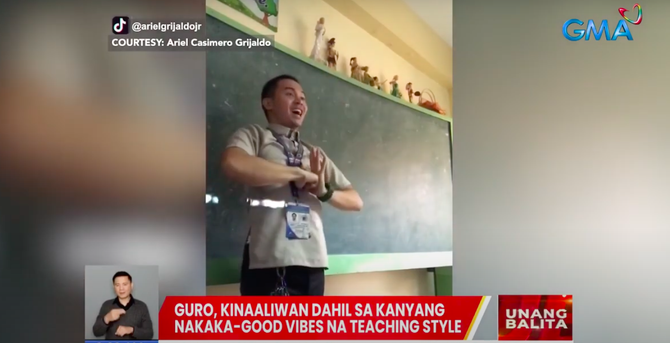 Guru mengajar gerakan tari kepada siswa sebelum kelas, populer online