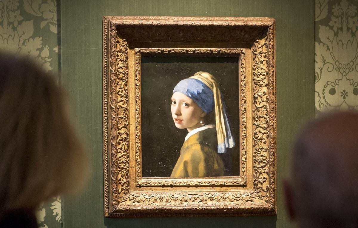 Activist glues his head to ‘Girl with a Pearl Earring’ painting in The ...