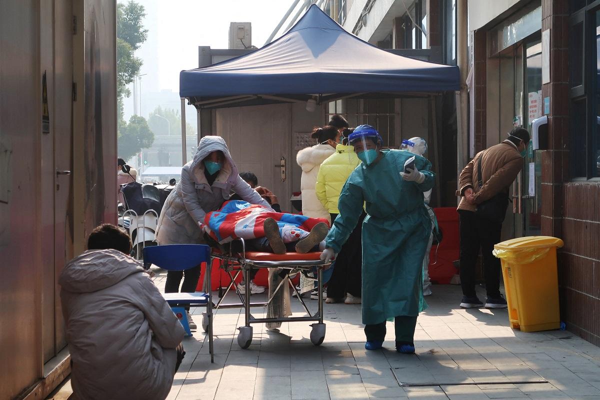 Queues form at fever clinics as China wrestles with COVID-19 surge