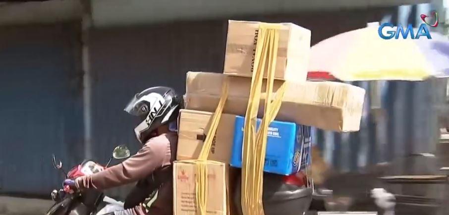 Delivery riders in Metro Manila receive cash aid from DSWD 