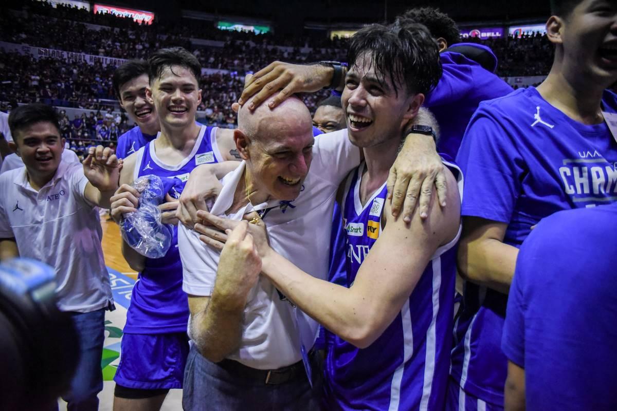 Ateneo head coach Tab Baldwin receives a splash from team, welcomes being back on top
