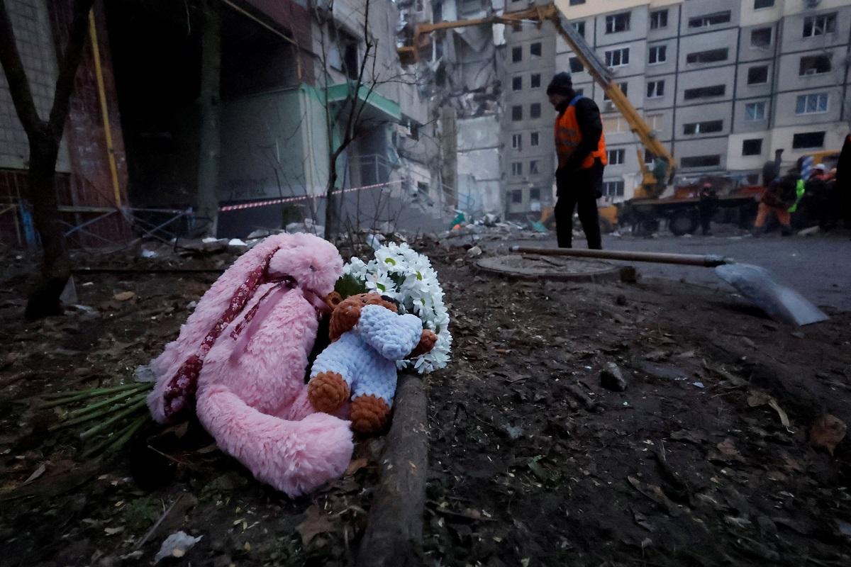 Tributes are left at an apartment block hit by a Russian missile strike, in Dnipro, Ukraine January 16, 2023. Dozens were killed, including at least three children. EU presidency holder Sweden denounced Russia's 'systemic attacks on civilians' as a war crime. REUTERS/ Clodagh Kilcoyne