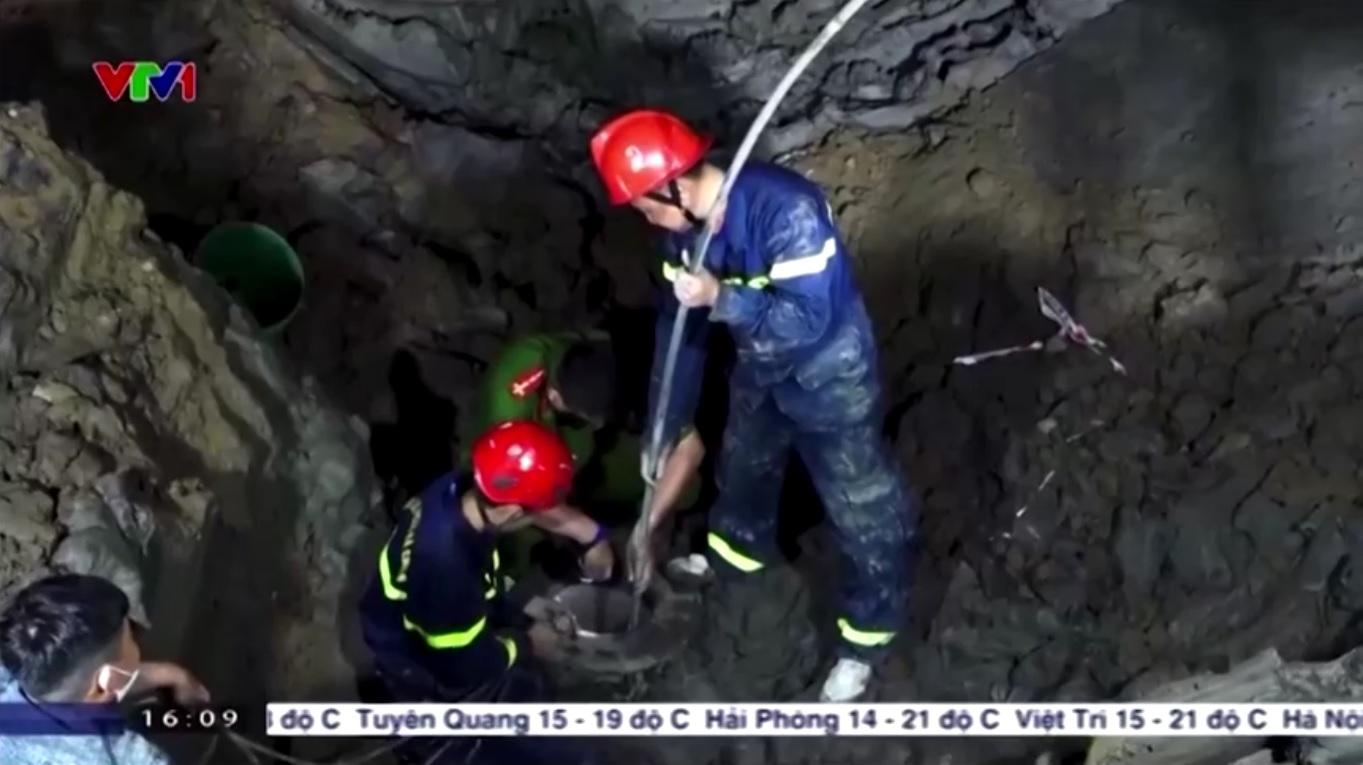 Rescuers in Vietnam try to save boy who fell into hole at construction site