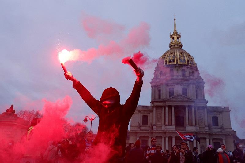 Huge crowds march across France, raising pressure against Macron’s pension reform