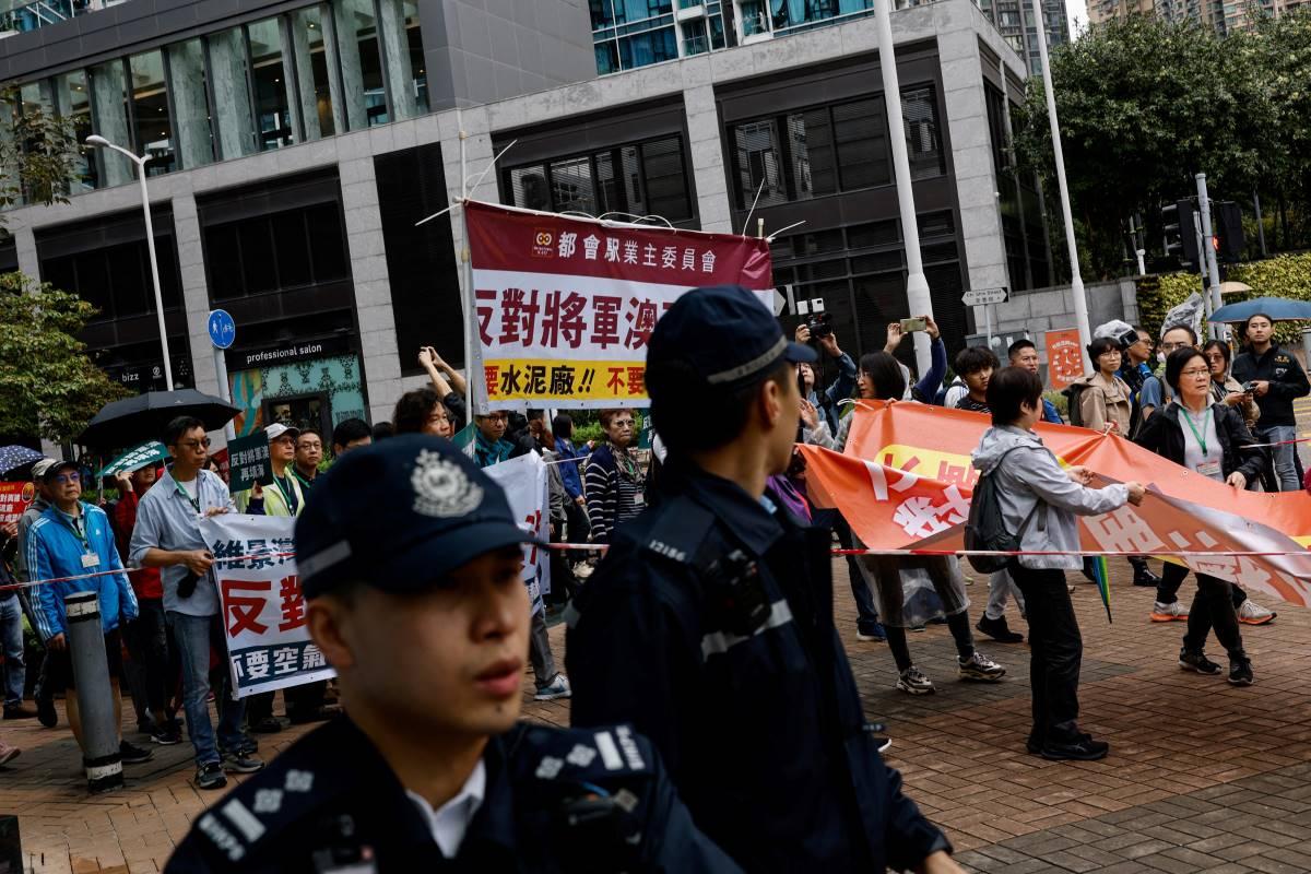 Hong Kong police keep tight tabs on first authorized protest in years