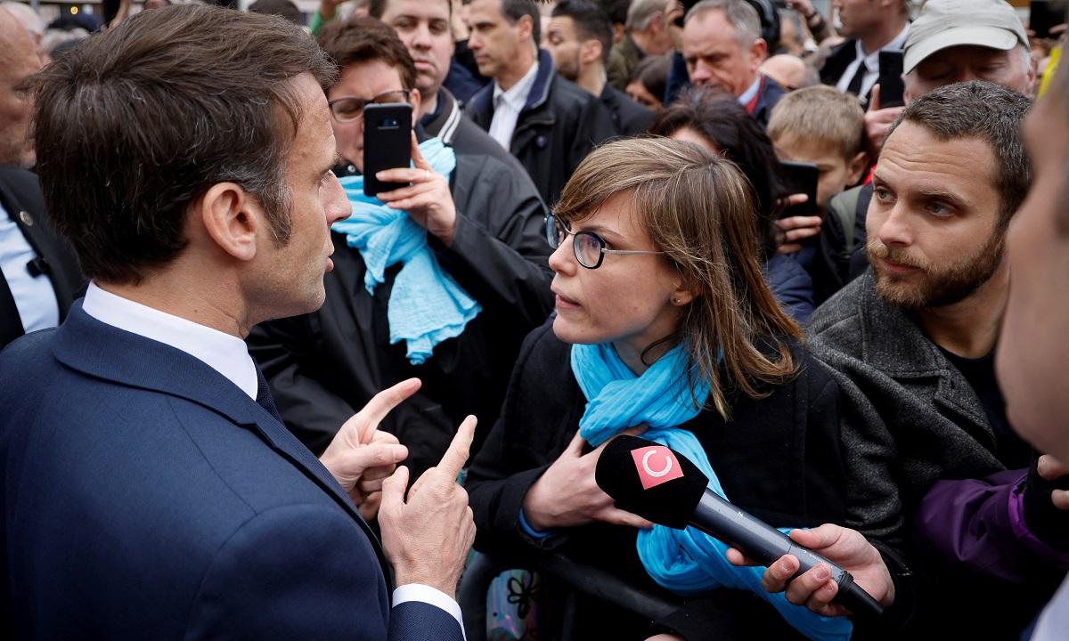 Angry crowd in eastern France heckles Macron over pensions legislation