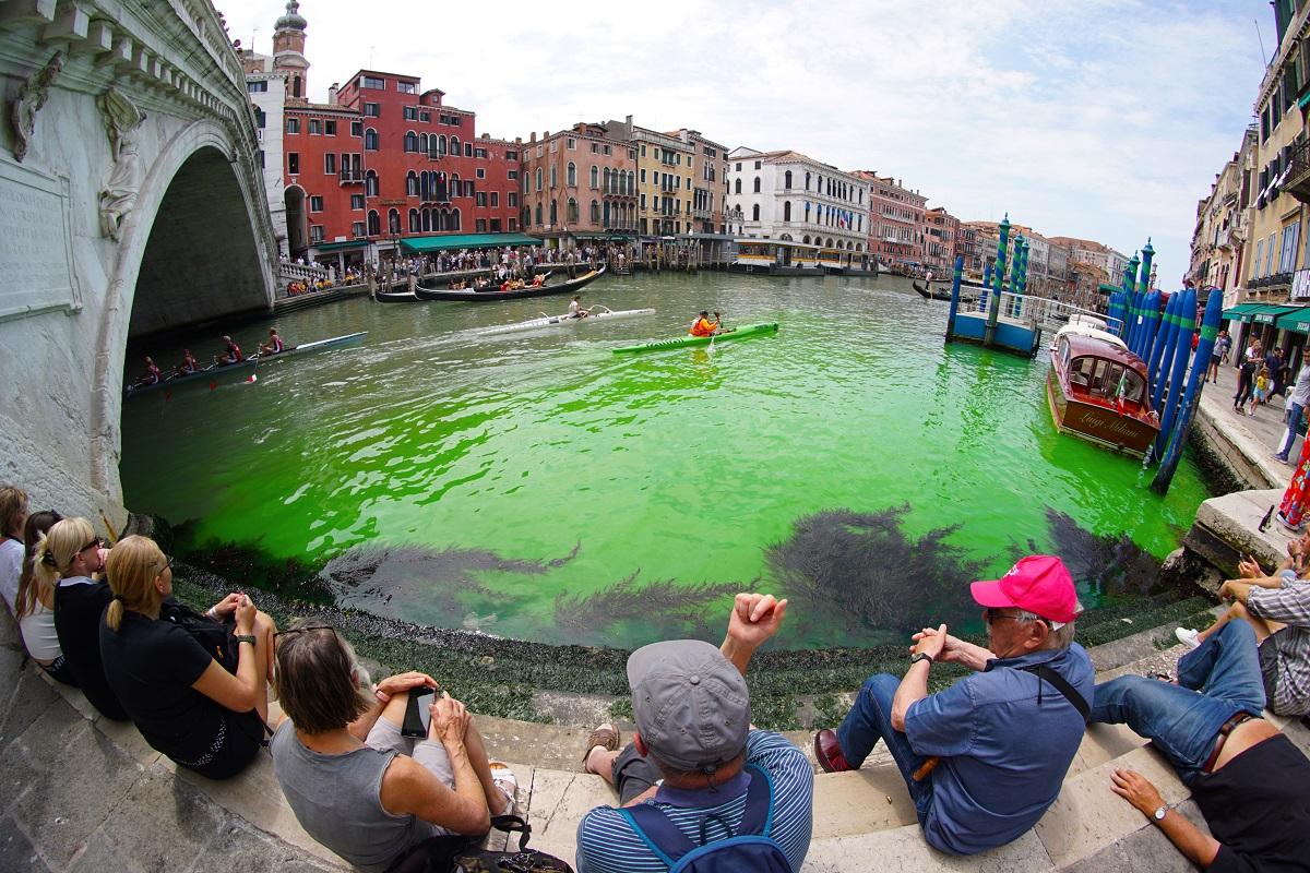 Venice’s Grand Canal turns phosphorescent green