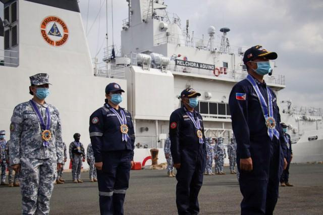 Members of the PCG and the BFAR are welcomed back on Monday, May 15, 2023 after installing five navigational buoys marked with the Philippine flag at various points in the West Philippine Sea. From May 10 to 12 on five PCG vessels, the PCG and the BFAR installed the buoys at Patag Island, Balagtas Reef, Kota Island, Panata Island, and Julian Felipe Reef. Photo: PCG