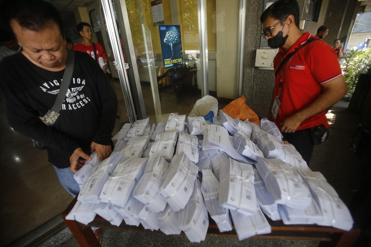 Philippine Postal Corporation personnel sort 2,588 national identification cards or PhilIDs set for delivery to Manila addresses on Tuesday, May 23, 2023 at the Foreign Surface Mail Distribution Center in Port Area, Manila, where Manila Central Post Office operations have been moved after a fire gutted its building. DANNY PATA 