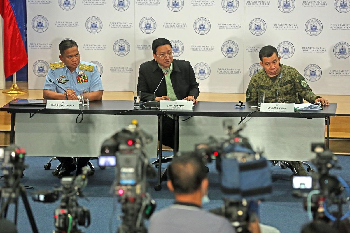 PCG spokesperson for the WPS Commodore Jay Tarriela, National Security Council spokesperson Jonathan Malaya, and AFP spokesperson Colonel Medel Aguilar are seen during a news conference in response to recent aggression of the Chinese Coast Guard against Philippine vessels in the West Philippine Sea, at the Department of Foreign Affairs in Manila on August 7, 2023. DANNY PATA