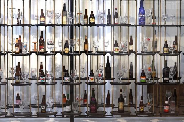 Beer bottles and glasses are displayed at the Belgian Beer World, the world's largest interactive experience center about beer, just opened in the renovated stock exchange building La Bourse/De Beurs, in Brussels, Belgium September 7, 2023. REUTERS/ Yves Herman