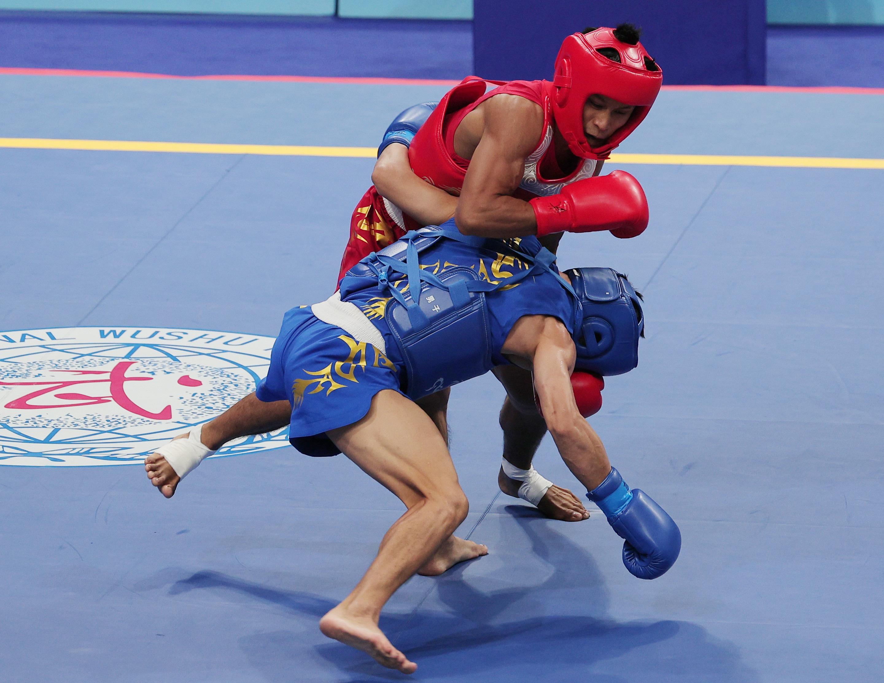 Arnel Mandal (in red) during the sanda men's 56kg finals in the Asian Games 2023 