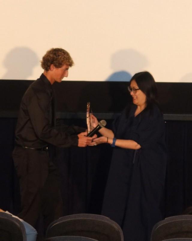 "Blue Room" Director Ma-an Asuncion-Dagnalan receives the film's award. Photo by Janet Susan R. Nepales