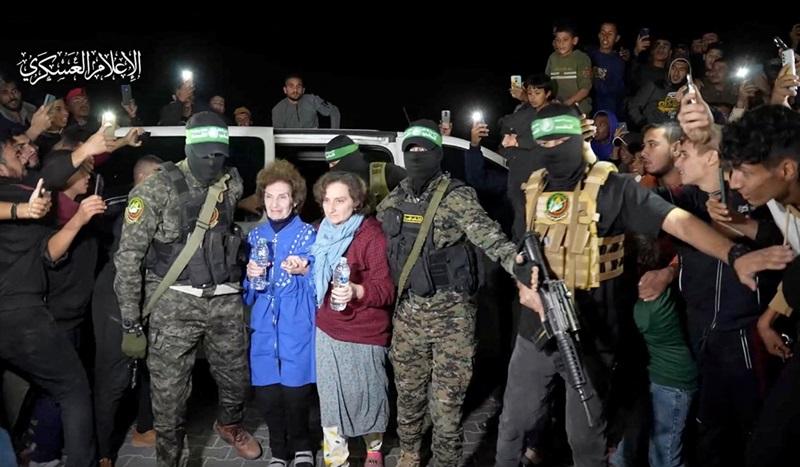 Israeli military says two released hostages arrive in Israel