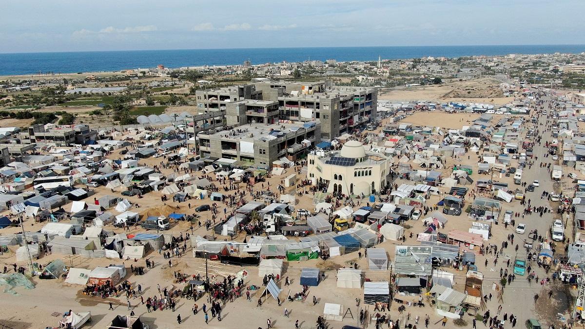 Displaced Palestinians take shelter in tent camps in Rafah