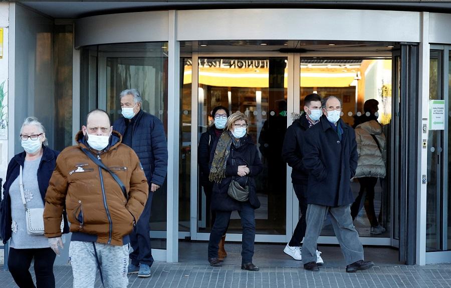 People wear masks at Germans Trias i Pujol Hospital in Spain