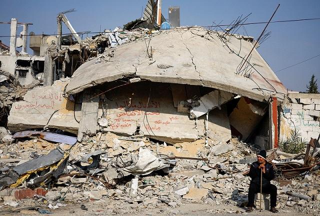In Gaza, family suffers painful wait for bodies of children buried alive