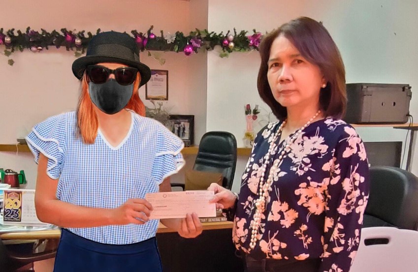 PCSO General Manager Mel Robles said the photo of the lotto winner is authentic but was edited to protect her identity. PHOTO: PCSO