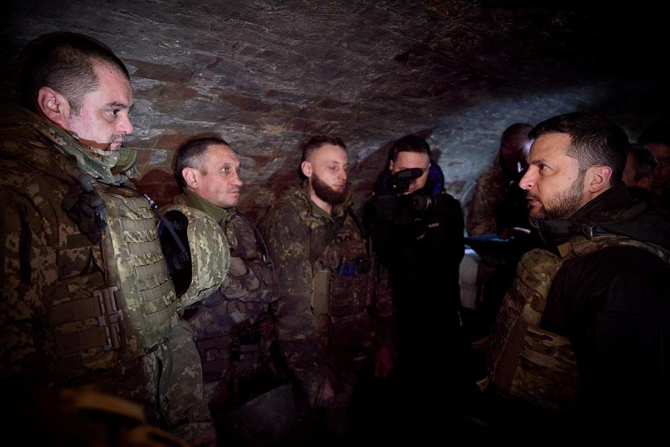 Ukraine's President Volodymyr Zelenskiy speaks with servicemen at the frontline