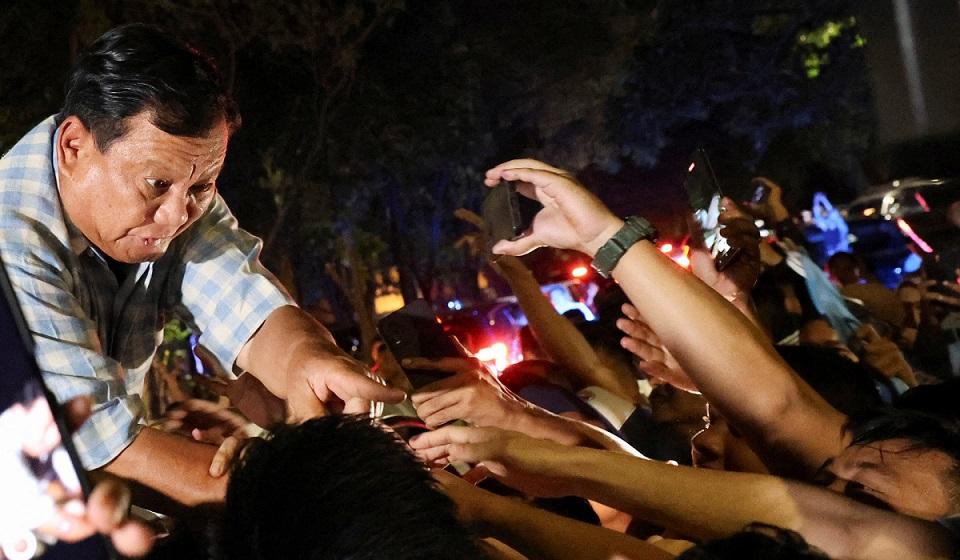 Indonesian presidential candidate Prabowo Subianto greets his supporters in Jakarta