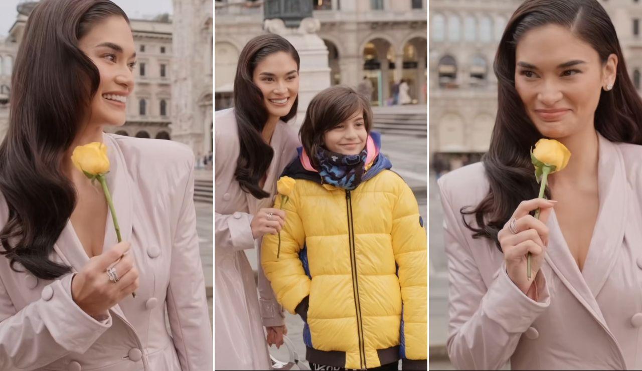 A boy in Milan gives Pia Wurtzbach a rose and she can’t stop smiling