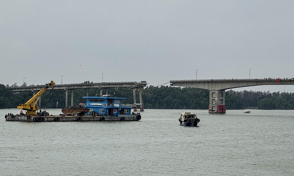 Two killed after barge hits bridge in China, plunging vehicles into the water