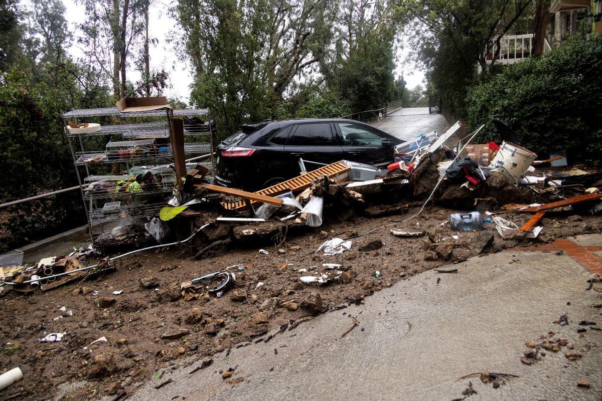 Lingering atmospheric river soaks California, threatening more flooding