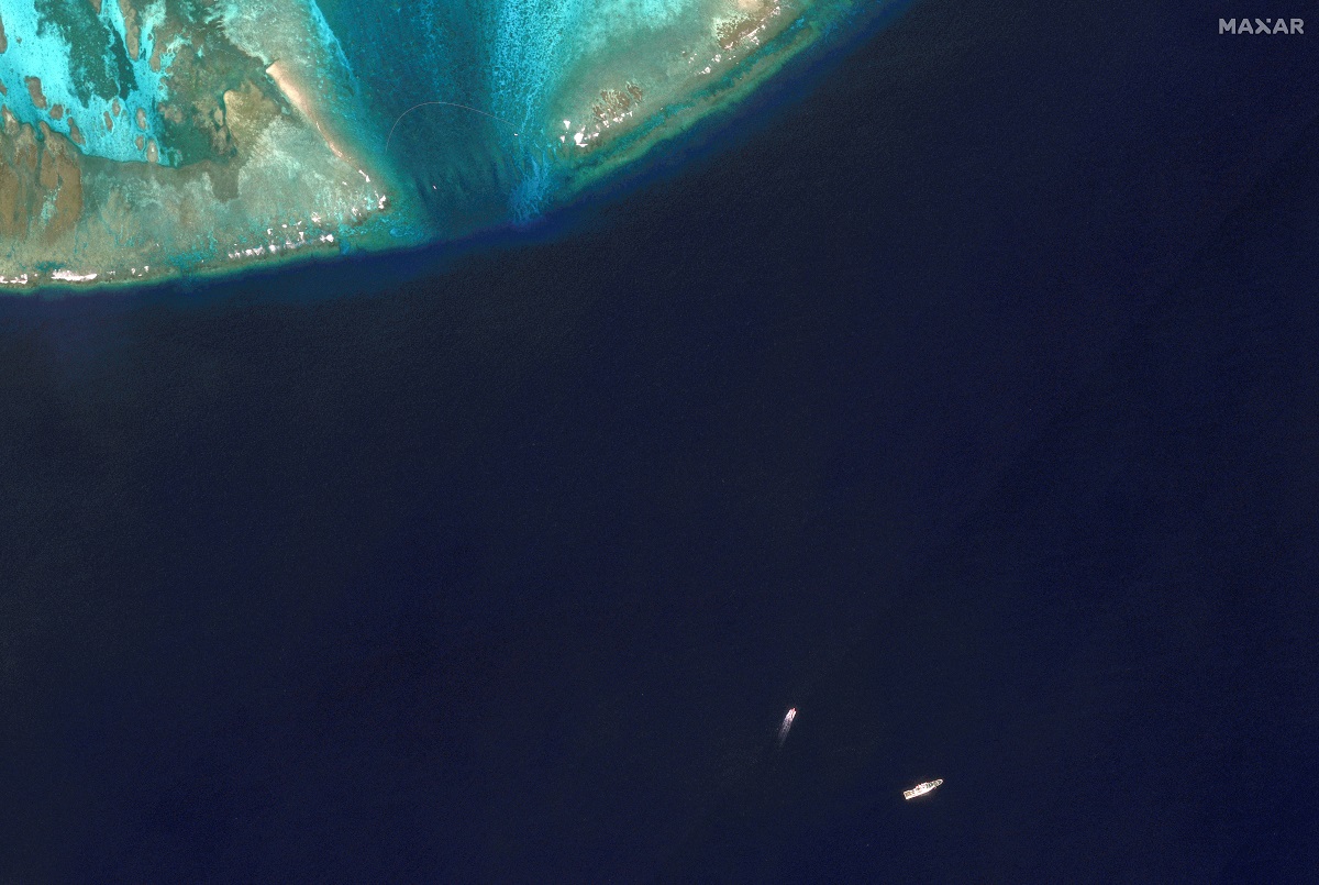 Satellite images reveal floating barrier at mouth of Scarborough Shoal
