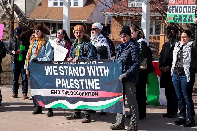 Supporters of the “Uncommitted” vote rally in support of Palestinians, in Michigan
