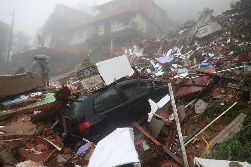 Rescuers race to find trapped people as Brazil storms kill at least 20